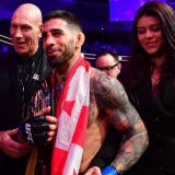 ilia-topuria-smile-belt-flag-imagn.jpg