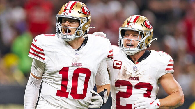 getty-mac-jones-christian-mccaffrey-49ers.jpg