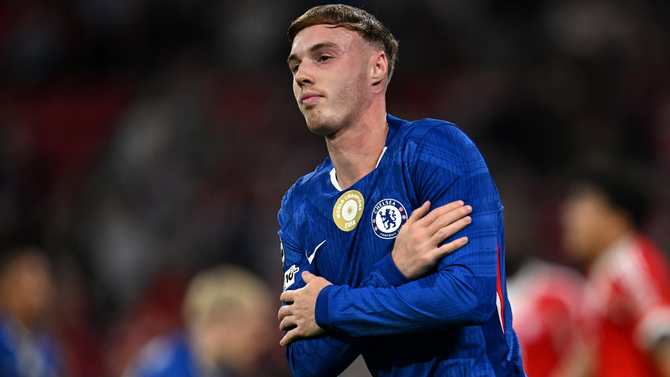Two football players competing for the ball, representing Chelsea and Liverpool
