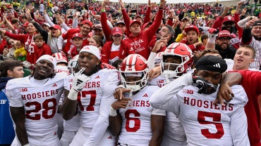 Indiana players celebrate after a big win on the road over Oregon