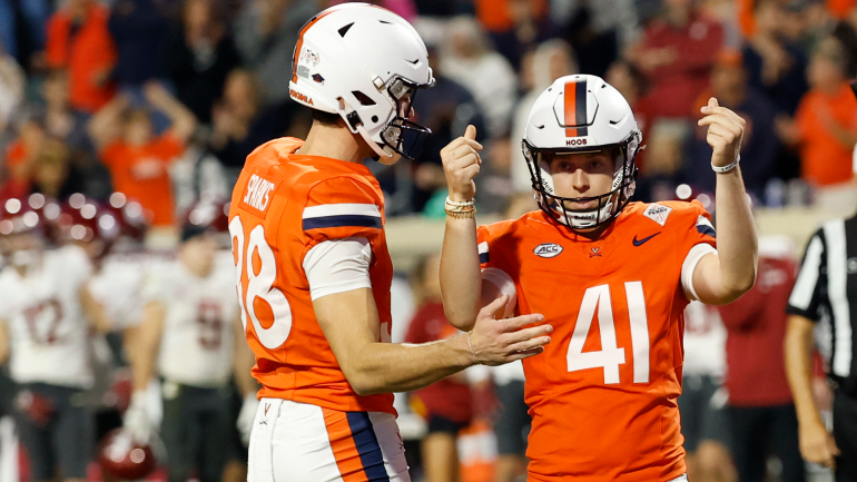 Virginia players react after a comeback win over Washington State in Week 8