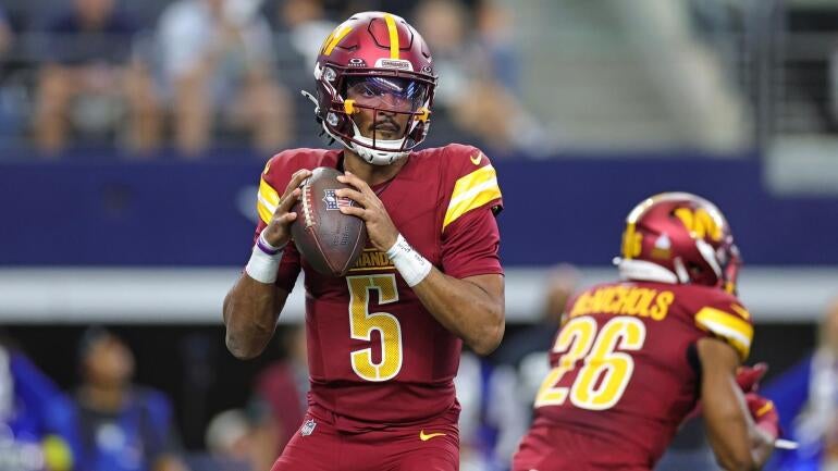Jayden Daniels, quarterback do Washington Commanders, em ação.
