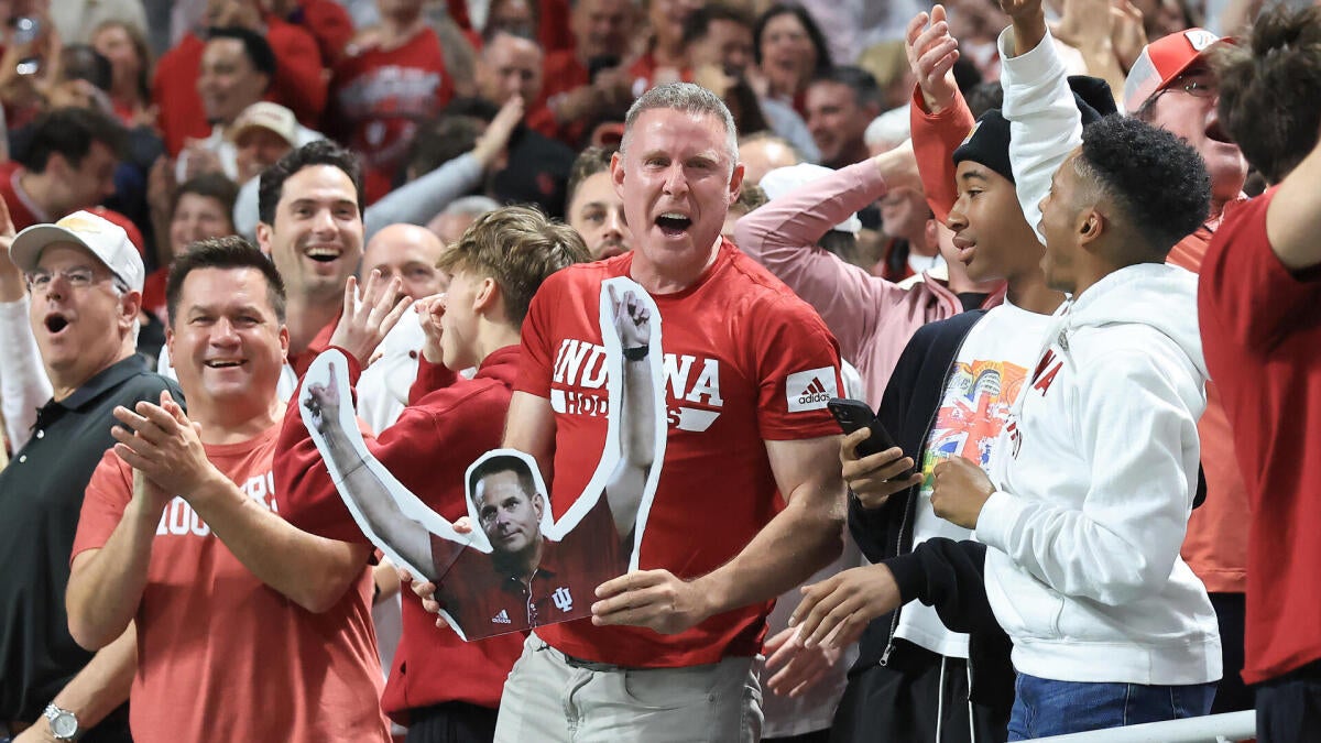 The world's largest fanbase, unleashed: Indiana's crimson wave rolls toward CFP title game