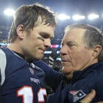 (012118 Foxboro, MA) New England Patriots quarterback Tom Brady hugs head coach Bill Belichick after winning the AFC Championship game at Gillette Stadium on Sunday, January 21, 2018. Staff Photo by Nancy Lane