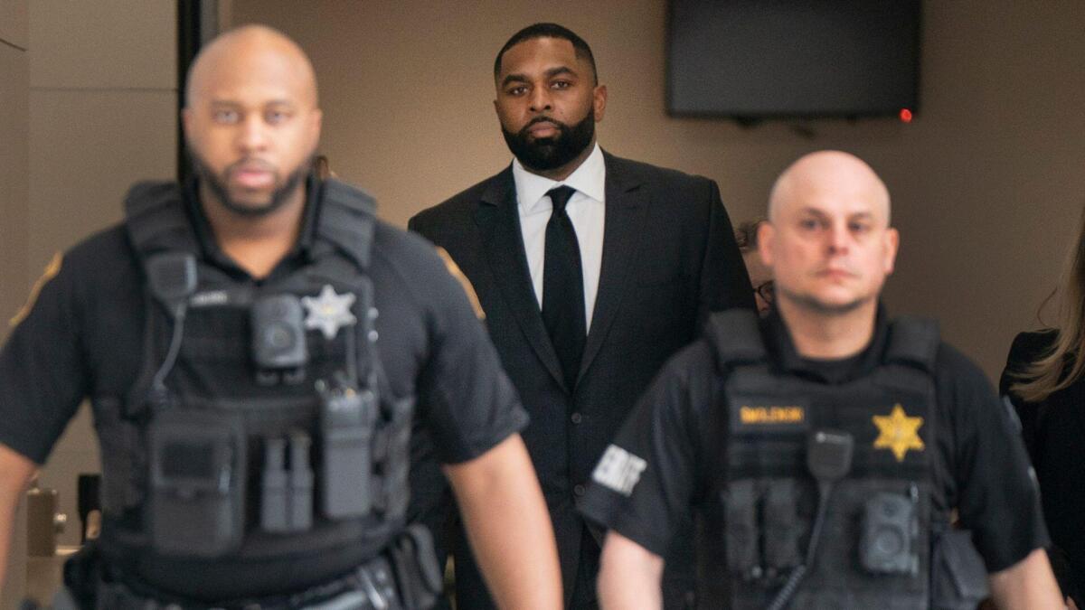 Ex-Michigan coach Moore reaches plea deal in home invasion case