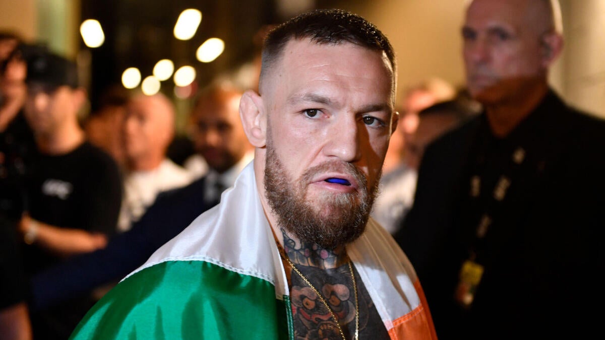 https://sportshub.cbsistatic.com/i/r/2026/07/09/175ea696-e45d-47a6-8680-3dda9dc2fa66/thumbnail/1200x675/c3646a2d070f9a5e5b579f85e52e953c/conor-mcgregor-flag-walkout-2021.jpg