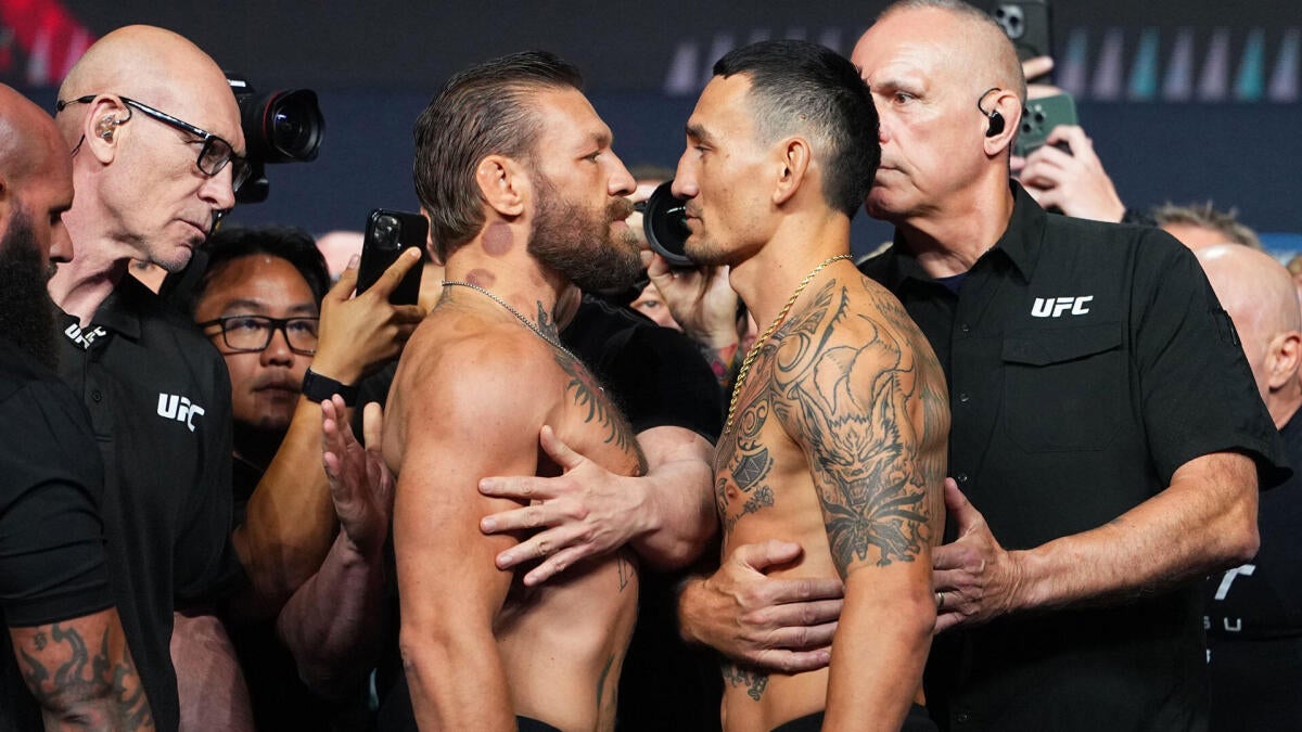 https://sportshub.cbsistatic.com/i/r/2026/07/11/80d7dcf8-a441-4f57-9598-2e5666a75cd9/thumbnail/1200x675/656ea68d9cdfc1df0c29bd0370276a56/conor-mcgregor-max-holloway-weighins.jpg