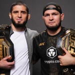 islam-makhachev-khabib-nurmagomedov-belts.jpg