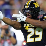 Missouri Tigers running back Ahmad Hardy (29) reacts to his first down pickup during the first quarter of the TaxSlayer Gator