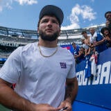 New York Giants running back Cam Skattebo (44) signs autographs following a 10-13 loss to Minnesota Vikings during a preseason