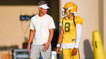 LSU Tigers head football coach Lane Kiffin talking with Quarterback Husan Longstreet 8 at LSU Football practice. August 18,