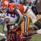 LSU running back Caden Durham (29) is tackled by the Clemson defense during their 2025 game at Memorial Stadium in Clemson, S.C.