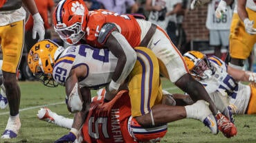 LSU running back Caden Durham (29) is tackled by the Clemson defense during their 2025 game at Memorial Stadium in Clemson, S.C.