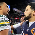 Packers QB Jordan Love and Bears QB Caleb Williams shake hands after a 2025 playoff game.