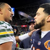 Packers QB Jordan Love and Bears QB Caleb Williams shake hands after a 2025 playoff game.