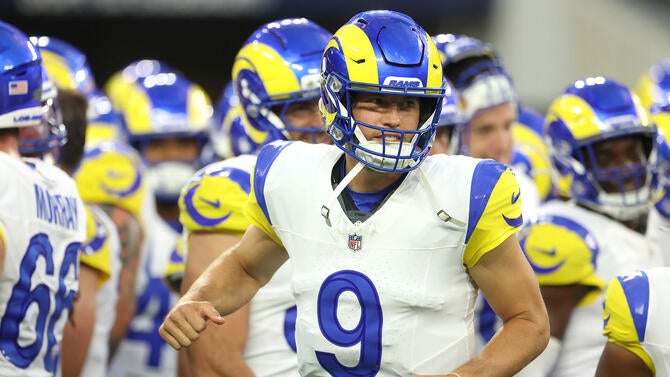 Rams QB Matthew Stafford (9) runs onto the field.