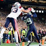 Josh Jobe intercepts a ball in front of Patriots receiver Mack Hollins