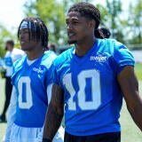 Detroit Lions running back Isiah Pacheco (10) walks off the field with running back Jahmyr Gibbs (0) after practice during OTAs