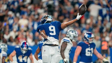 New York Giants tight end Isaiah Likely (9) throws the football in the air after scoring a touchdown during a week one opening