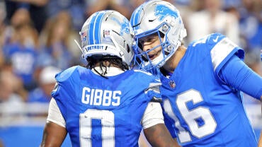 getty-jahmyr-gibbs-jared-goff-lions.jpg
