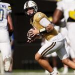 Vanderbilt quarterback Jared Curtis (2) looks for a receiver against Delaware during the first quarter at FirstBank Stadium in