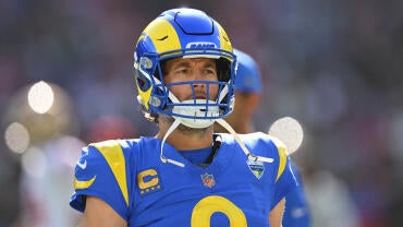 Matthew Stafford, in a blue Rams jersey, stares off into the distance during the opener against the 49ers.