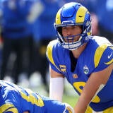 Quarterback Matthew Stafford is under center in a blue uniform.