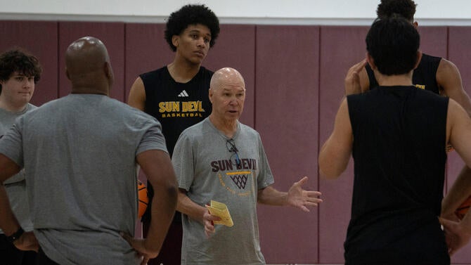 ASU men's basketball coach Randy Bennett (center) talks with his team during practice at the Weatherup Center in Tempe, Arizona,