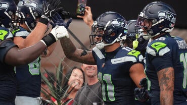 Seattle Seahawks receiver Jaxon Smith-Njigba (11) celebrates a touchdown against the Arizona Cardinals at State Farm Stadium in