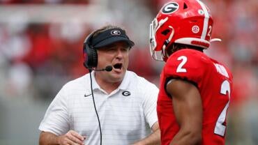 Georgia coach Kirby Smart celebrates with Georgia running back Kendall Milton (2) after he scored a touchdown during the first