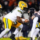 The Green Bay Packers line up against the Chicago Bears across the line of scrimmage during a 2025 football game.