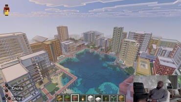 Mike Tomlin is in a split screen box describing his virtual Minecraft city, which includes a vast lake, urban architecture, and a massive city.