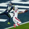 Patriots Christian Gonzalez breaks up a pass against Jaxon Smith-Njigba during Super Bowl LX.