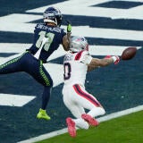 Patriots Christian Gonzalez breaks up a pass against Jaxon Smith-Njigba during Super Bowl LX.