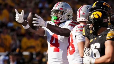 Ohio State Buckeyes wide receiver Jeremiah Smith (4) reacts to a first down catch during the NCAA football game against the Iowa
