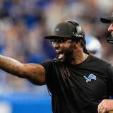 Detroit Lions defensive coordinator Kelvin Sheppard reacts to a play against Cleveland Browns next to head coach Dan Campbell
