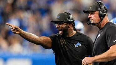 Detroit Lions defensive coordinator Kelvin Sheppard reacts to a play against Cleveland Browns next to head coach Dan Campbell