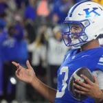 Kentuckyís Kenny Minchey runs in the 2 point conversion to win the game against LSU at Kroger Field Saturday evening.
Oct. 10,