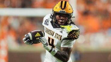 Kennesaw State wide receiver Zion Booker (4) carries the ball during a college football game against Tennessee on Sept. 19,