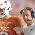 getty-arch-manning-steve-sarkisian-texas.jpg
