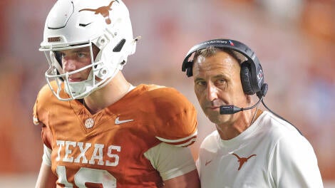 getty-arch-manning-steve-sarkisian-texas.jpg