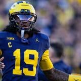 Michigan quarterback Bryce Underwood (19) runs off the field after his pass was intercepted by Penn State during the first half