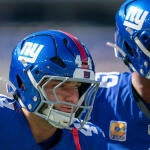 New York Giants quarterback Jameis Winston (19) and New York Giants running back Cam Skattebo (44) warm up together during a