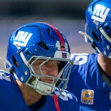 New York Giants quarterback Jameis Winston (19) and New York Giants running back Cam Skattebo (44) warm up together during a