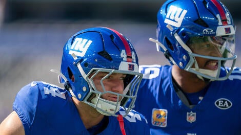 New York Giants quarterback Jameis Winston (19) and New York Giants running back Cam Skattebo (44) warm up together during a