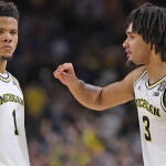 getty-trey-mckenney-elliot-cadeau-michigan.jpg