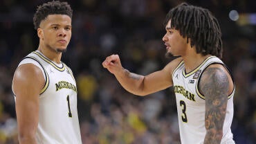 getty-trey-mckenney-elliot-cadeau-michigan.jpg