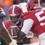 Tennessee linebacker Jeremiah Telander (22) sacks Alabama quarterback Keelon Russell (12) during a game between Tennessee and