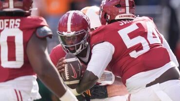 Tennessee linebacker Jeremiah Telander (22) sacks Alabama quarterback Keelon Russell (12) during a game between Tennessee and