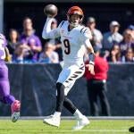 Cincinnati Bengals quarterback Joe Burrow (9) scrambles in the first quarter of the NFL Week 7 game between the Baltimore Ravens